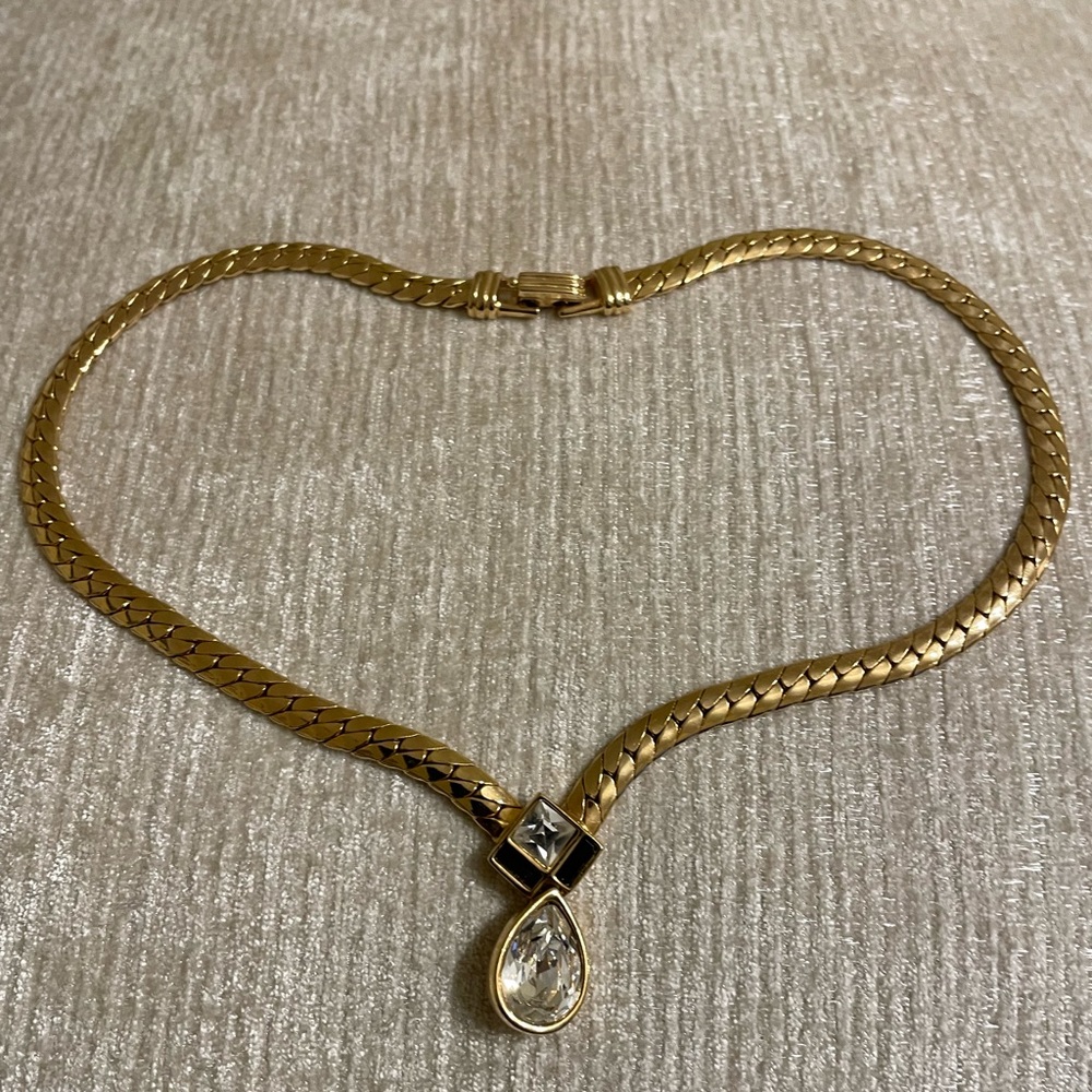Gold colored necklace with faux crystal teardrop